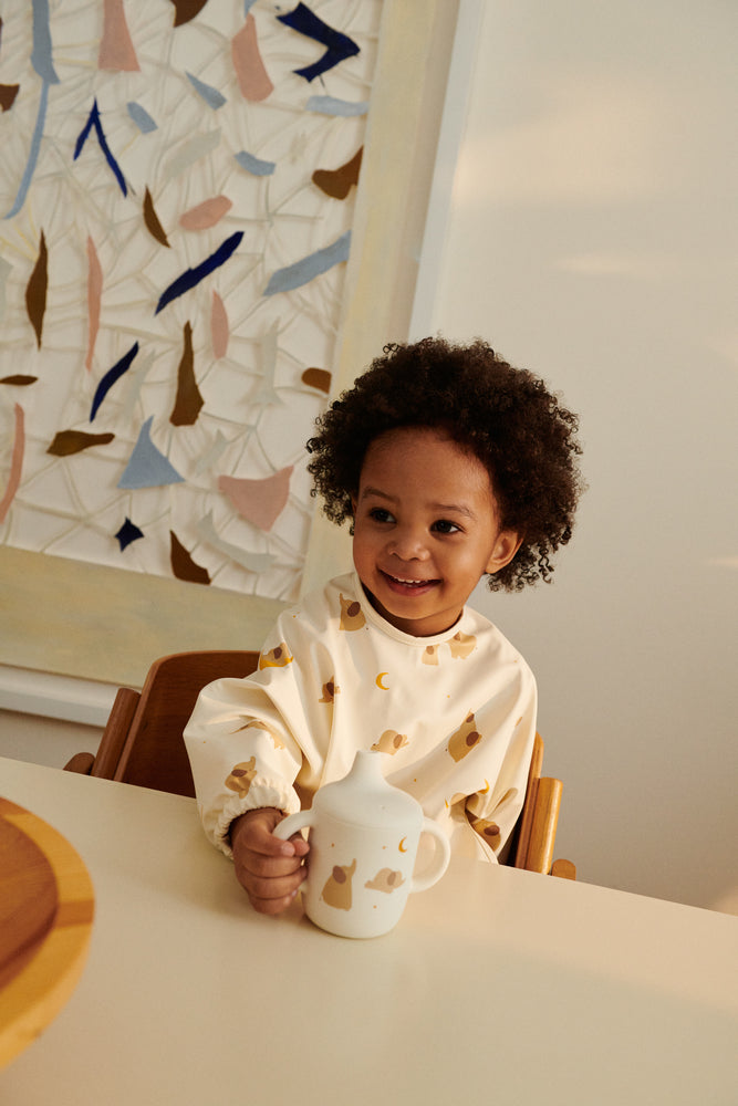 Bavoir avec manches MERLE -  Elephant / Creme de la creme Liste 